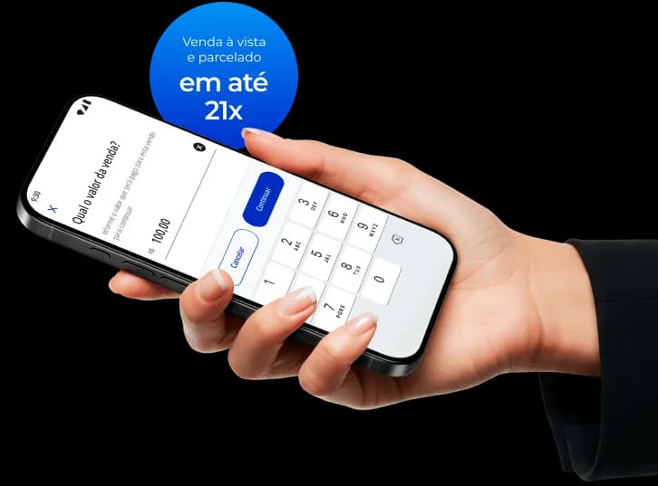 Mão de uma pessoa segurando um celular enquanto informa o valor de uma venda cuja cobrança será por meio do Asaas Tap. Ao lado, um selo escrito "Venda à vista e parcelado em até 21x".